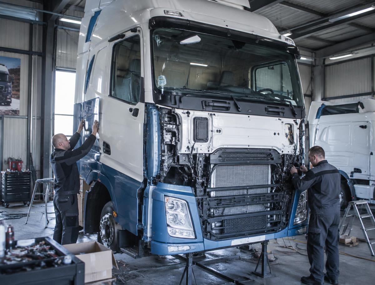 Technicians working on a truck cab during refurbishment